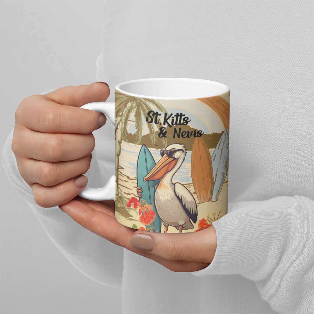 White ceramic mug with pelican illustration and St. Kitts & Nevis text, held