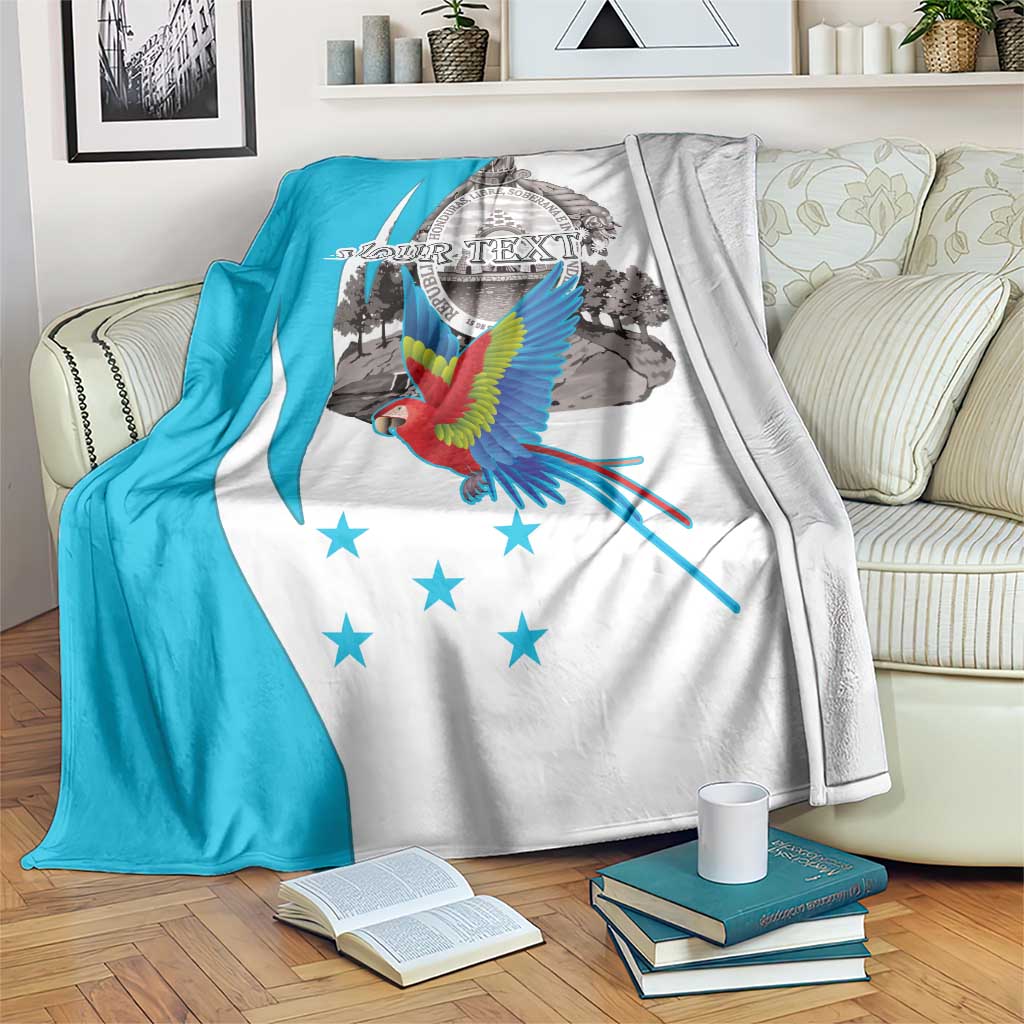 Turquoise and white personalized blanket with flying scarlet macaw and coat of arms