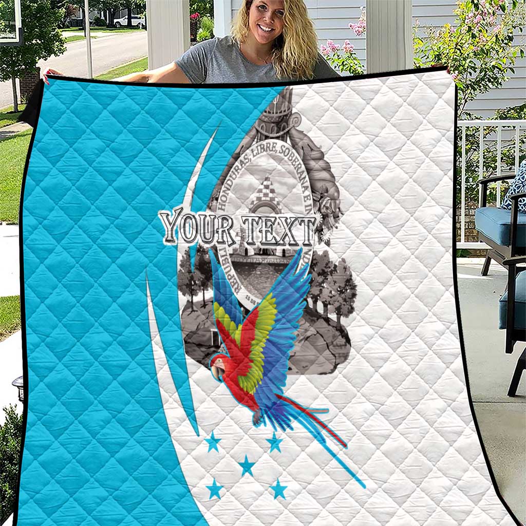 Personalized Honduras quilt featuring a macaw over a coat-of-arms crest, blue and white