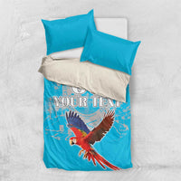 Blue duvet and 2 pillowcases, scarlet macaw print with custom text and “00”