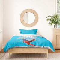 Blue duvet and pillow, scarlet macaw print with “00” and custom text