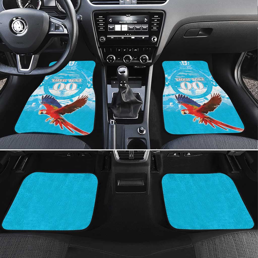 Blue car floor mat set with scarlet macaw design and custom text medallion, 4-piece layout.