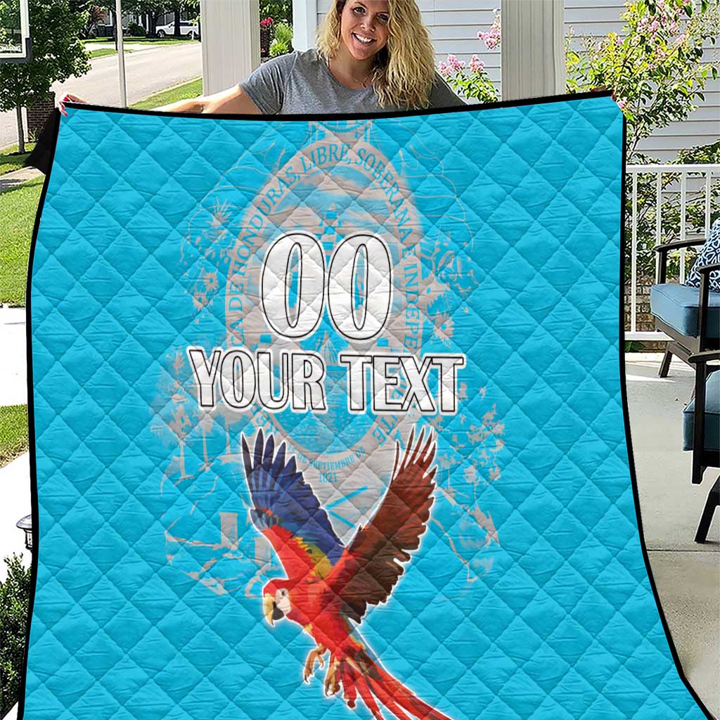 Blue quilt with quilted pattern and parrot graphic, custom “00 YOUR TEXT” design