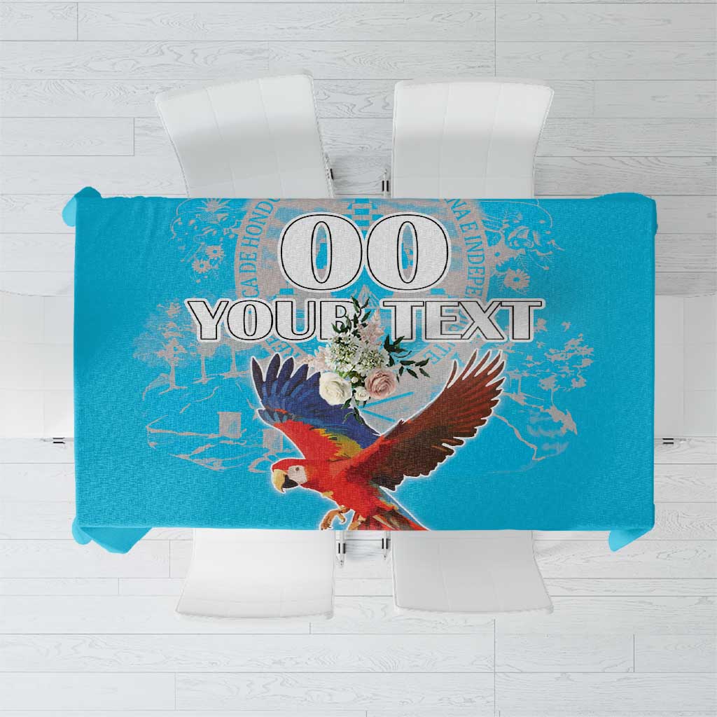 Blue tablecloth featuring red bird wings graphic with small floral accents