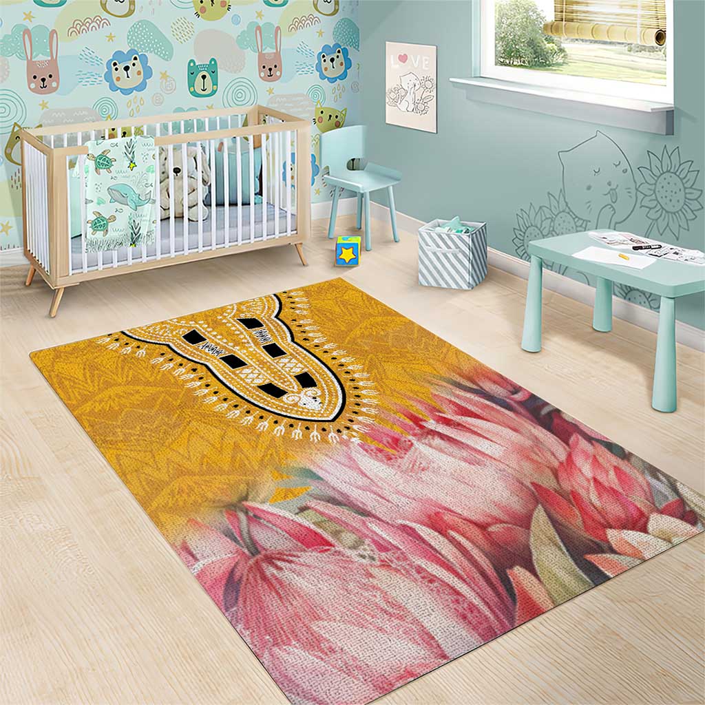 Yellow rug featuring a central paisley medallion over pink floral motifs