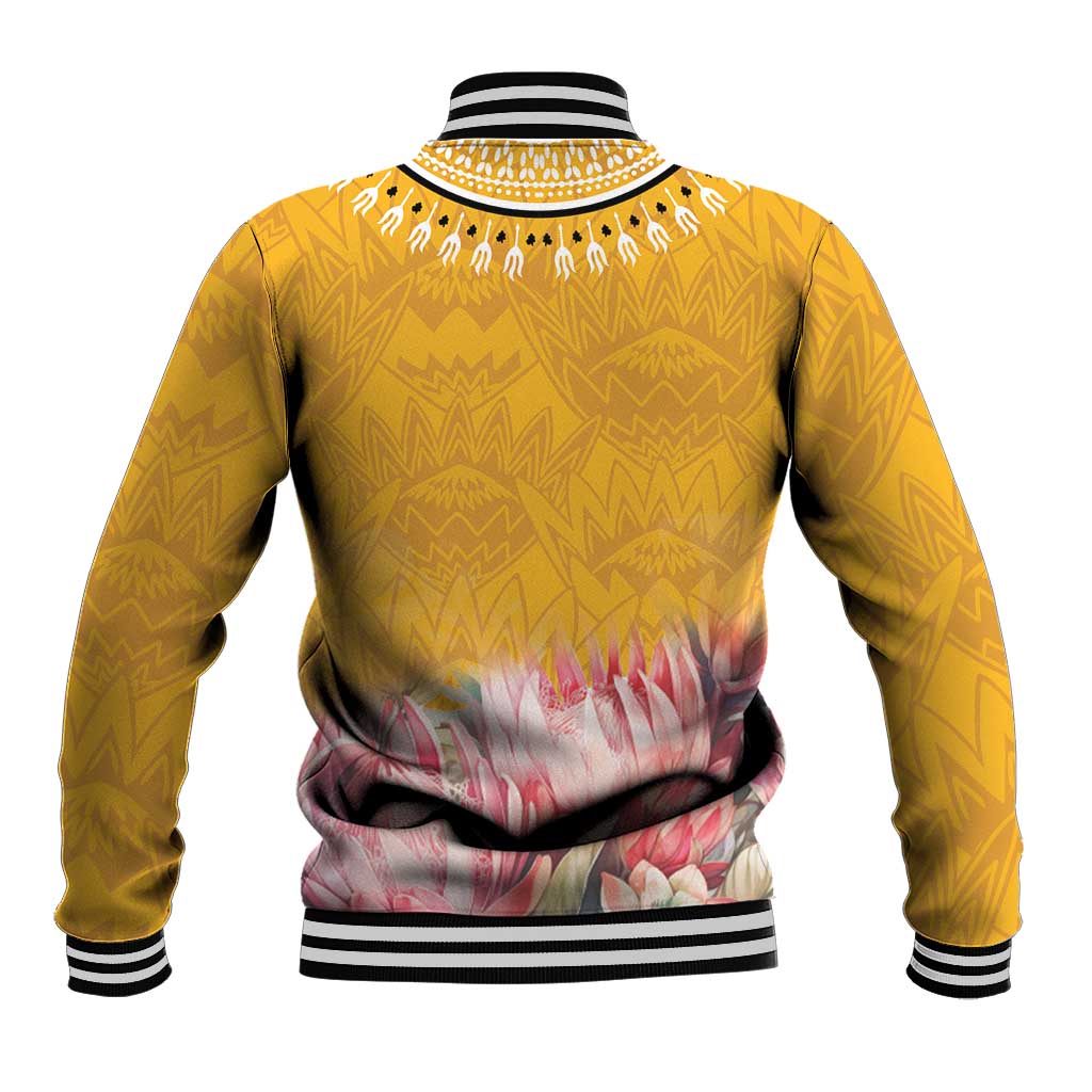 Yellow baseball jacket back view with striped cuffs, dashiki zigzag pattern, floral band