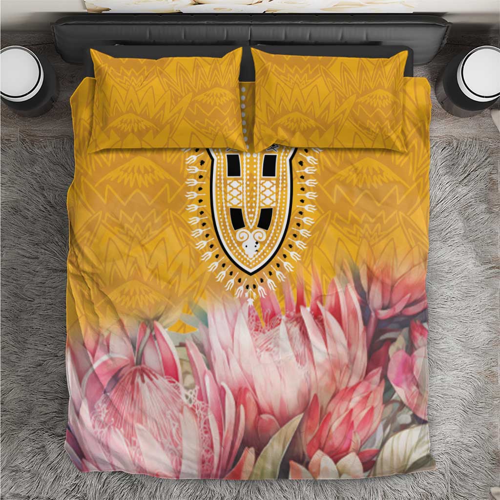 Yellow and pink floral bedding set with patterned decorative central medallion and two pillows