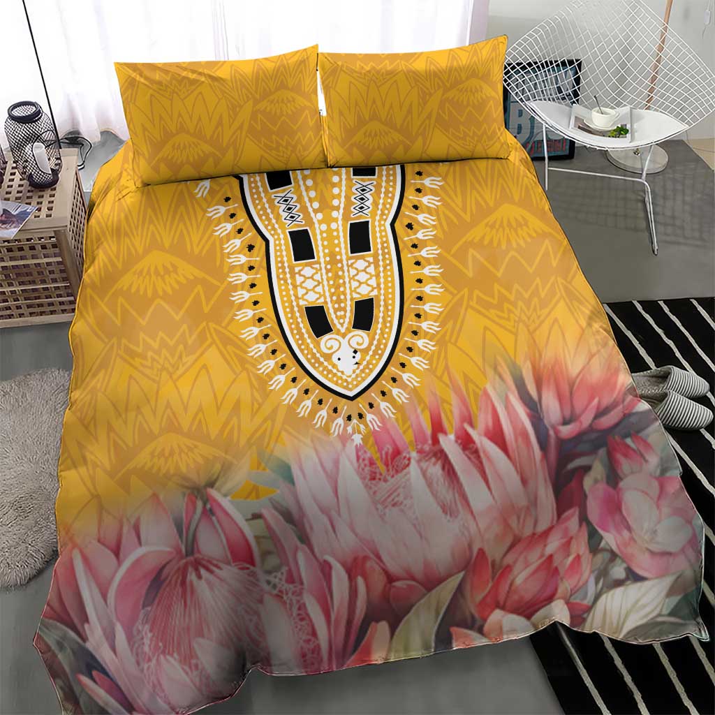 Yellow bedding set with pink protea floral design, central tribal medallion, and two pillows