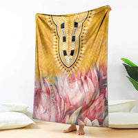 King-size blanket with ornate dark face pattern on yellow top and pink flower bottom