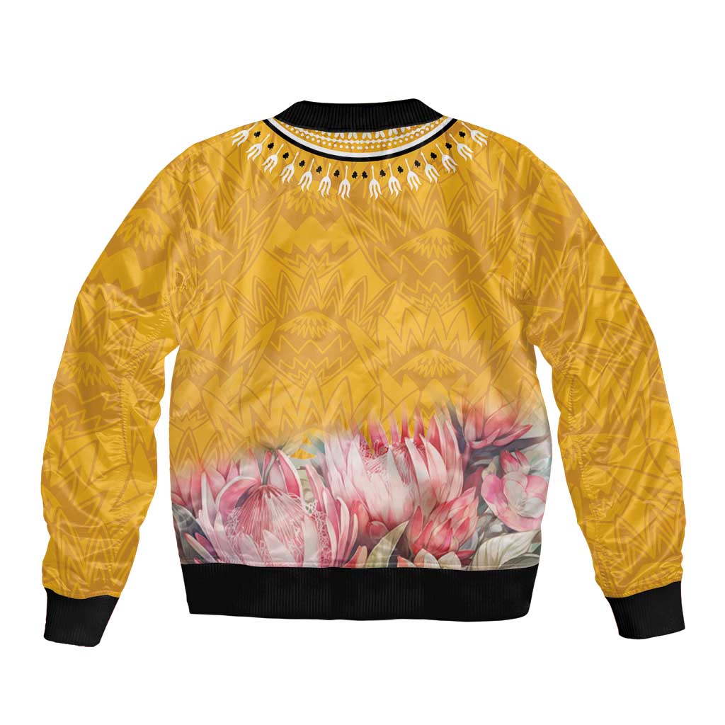Yellow bomber jacket with black ribbed collar and hem, pink protea floral panel