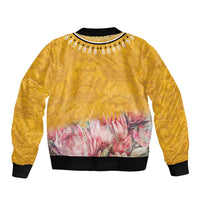 Yellow bomber jacket with black ribbed collar and hem, pink protea floral panel