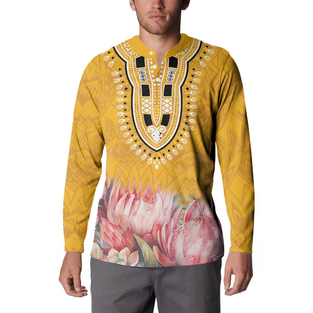 Yellow dashiki button sweatshirt worn by model, black-and-white chest motif and pink floral print