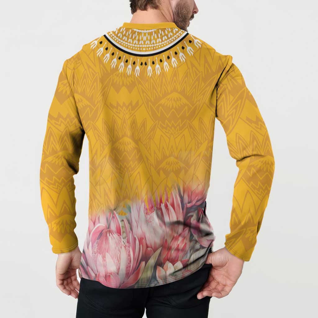 Yellow dashiki sweatshirt back view with geometric print and pink floral graphic, long sleeves
