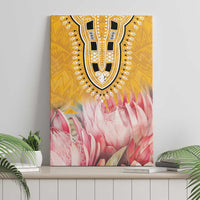 Yellow canvas wall art with tribal U-pattern and pink protea floral motif, standing