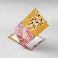 Yellow canvas wall art shown in 3D angle, tribal U-pattern and pink protea motif