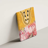 Yellow canvas wall art featuring tribal U-pattern above pink protea floral design