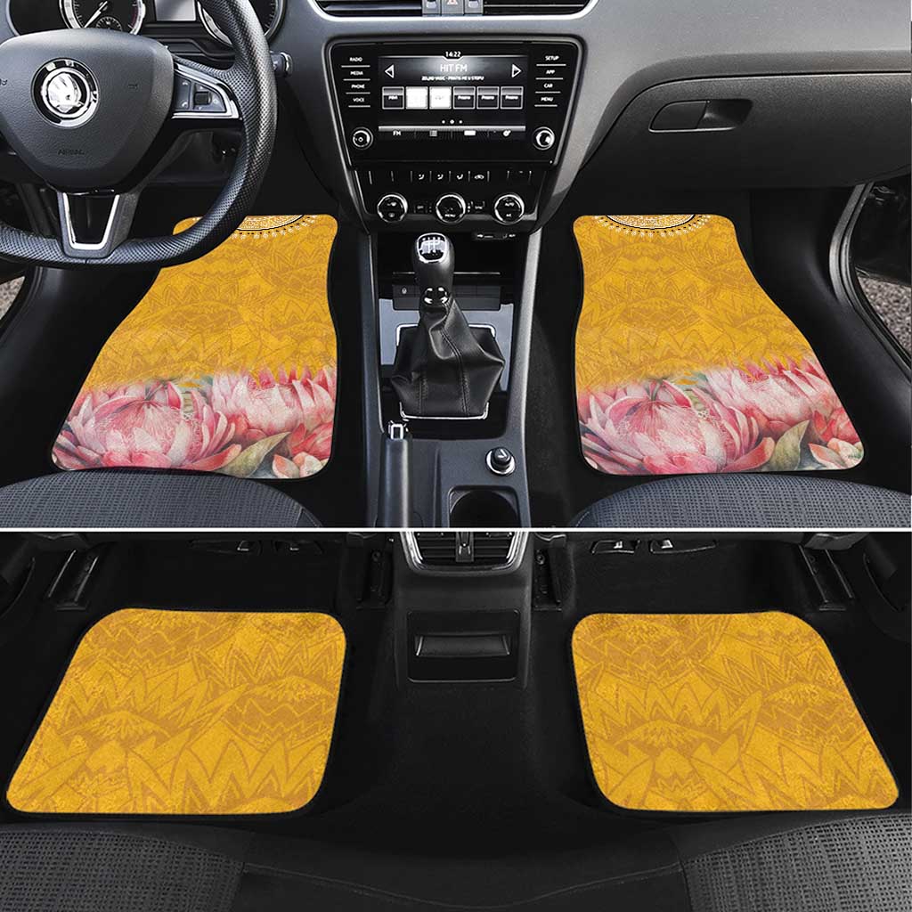 Set of four yellow car floor mats with geometric pattern and pink floral protea motif