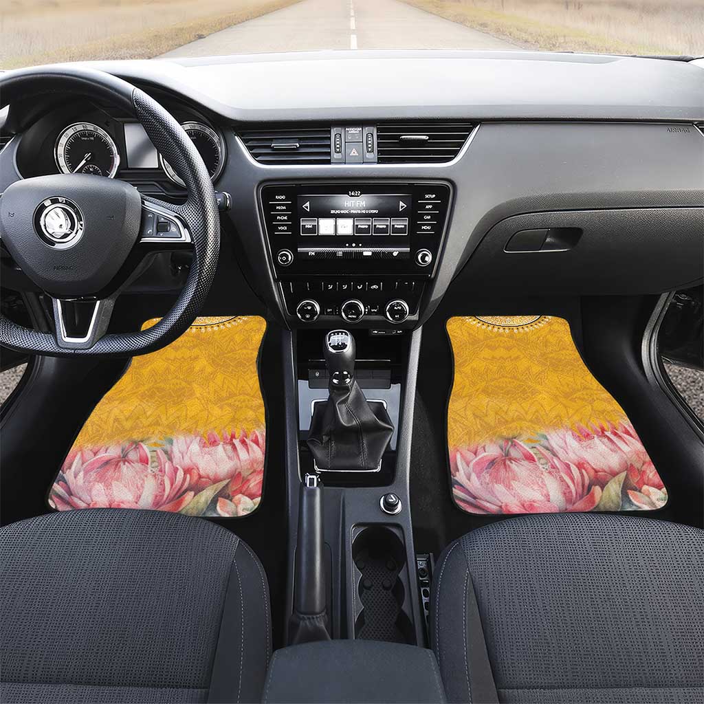 Yellow car floor mat set with geometric pattern and pink floral protea motif, full interior