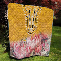 Yellow quilt with pink floral lower half and central black-and-white dashiki motif