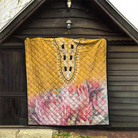 Yellow quilt with diamond quilting, pink floral bottom, and detailed dashiki-style central panel