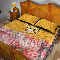 Yellow quilt bed set with dashiki oval medallion, pink floral wave bottom, two quilted pillow shams