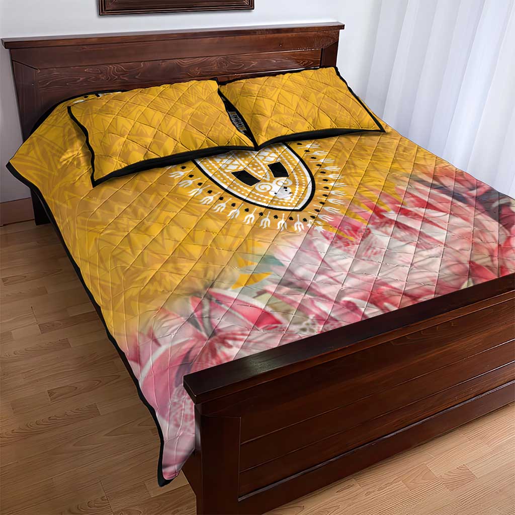 Yellow and pink quilt bed set with black-trimmed dashiki oval motif and two matching pillowcases