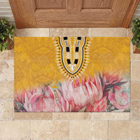 Yellow floral rubber doormat featuring a black-and-white medallion and pink blossom print