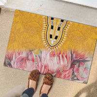 Yellow rectangular rubber doormat with tribal medallion design and pink flower print