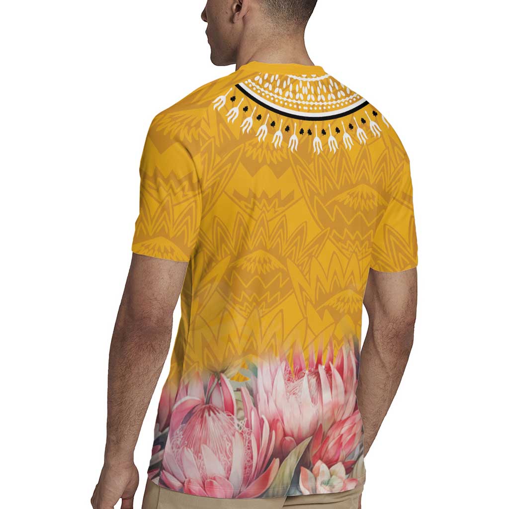 Yellow rugby jersey back with geometric zigzag print and pink floral band near the hem