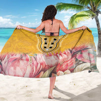 Yellow sarong with back view shield motif, pink botanical flowers, and sheer drape