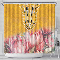 Yellow shower curtain with central dashiki-style emblem and pink flower print