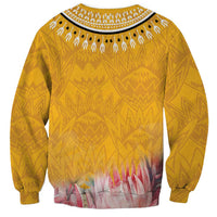 Yellow dashiki-style sweatshirt, allover geometric pattern and floral hem, long sleeves