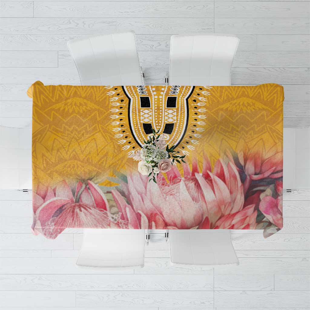 Rectangular floral tablecloth with yellow base, pink petals, and ornate black center motif