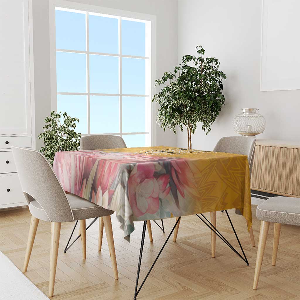Floral tablecloth with pink flowers and yellow background, spread over dining table