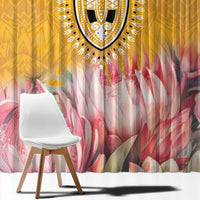 Yellow window curtain panel with dashiki-style trim and pink protea floral pattern