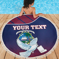 Round beach blanket with dove crest graphic, blue-red pattern, and white fringe edge
