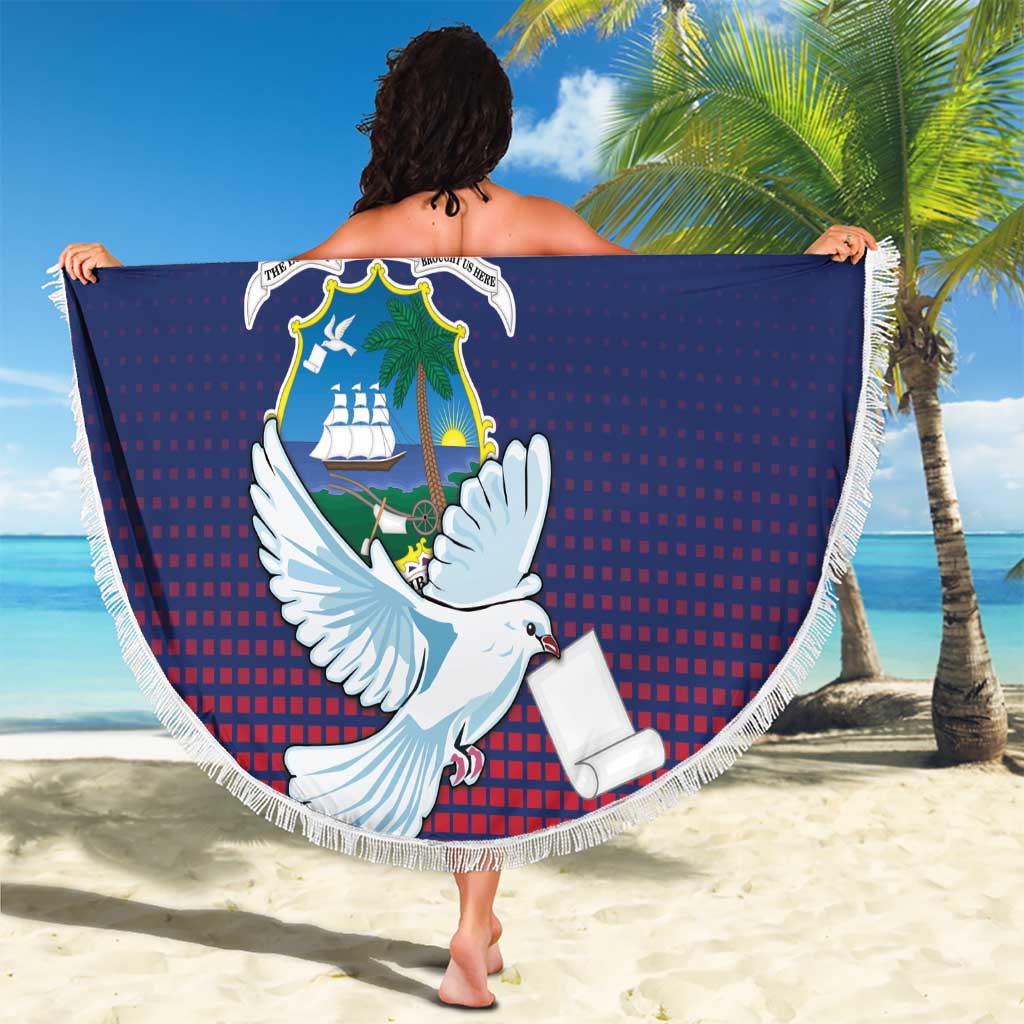 Round beach blanket draped by person: blue-red dove crest design with white fringe border