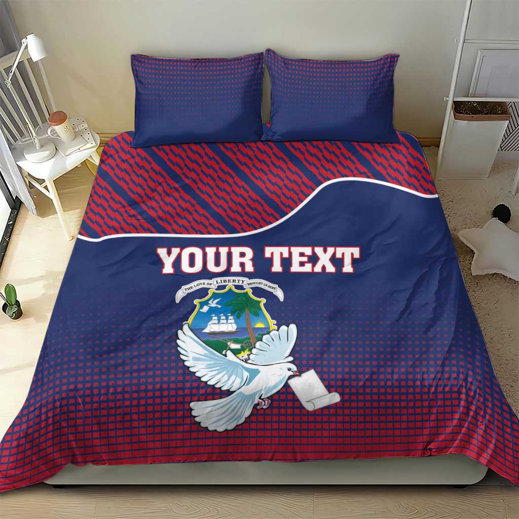 Blue and red bedding set with Liberia coat of arms, white dove motif, and “YOUR TEXT” headline.