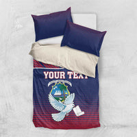 Blue and red duvet cover with Liberia crest and white dove, paired with two matching pillowcases.
