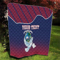 Personalized quilt blanket with Liberia dove and coat of arms, blue and red quilted close-up