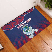 Blue personalized rubber doormat with white dove holding scroll and red patterned border