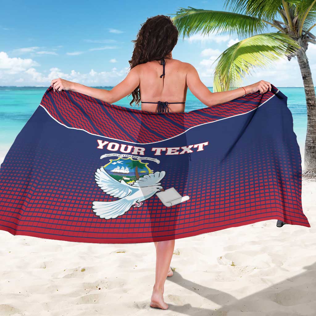 Liberia dove sarong coat, back view, custom text and emblem, blue/red patterned wrap