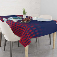 Navy and red patterned tablecloth with centered dove motif over dining table