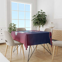 Navy and red patterned tablecloth with dove motif on dining table