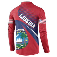 Red long-sleeve henley showing back crest, dotted pattern, and flag stripe on sleeves.