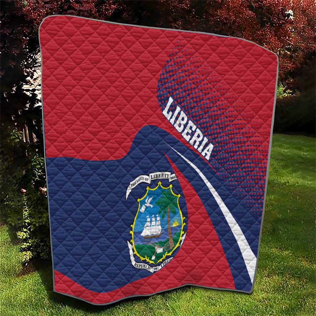 Liberia flag quilt, red and blue with Liberia text and coat of arms centered on quilted face