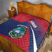 Liberia flag quilt on bedspread, red and blue with Liberia text and coat of arms emblem