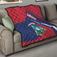 Liberia flag quilt on sofa, red and blue stripes with quilted texture and central coat of arms