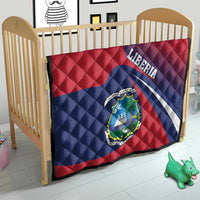 Liberia flag quilt on crib mattress, red and blue with Liberia lettering and coat of arms