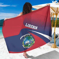 Red Liberia sarong fully spread, showing LIBERIA text and coat of arms crest